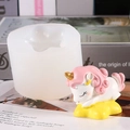 White silicone unicorn candle mold shown with finished colorful sleeping unicorn resin craft - 50-2606 White