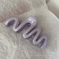 Detailed top view of purple wave-shaped hair claw clip with a glossy jelly finish - Taro Purple
