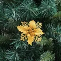 Sparkling gold poinsettia Christmas flower decoration on festive pine tree branches - Custom Gold