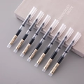 Detailansicht von sieben 0,5 mm schwarzen Tintenrollern auf einem Buch mit mattiertem Gehäuse - 0.5mm / Schwarz