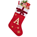 Detail of red velvet Christmas stocking with white knit cuff and gold glitter letter A - Red A
