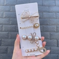 Detailed view of 4-piece pearl and rhinestone hair clip set with gold alloy base - Musical Note (4 Piece Set)