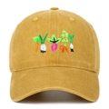 Macro view of detailed vegetable embroidery on washed cotton mustard yellow baseball cap - Yellow