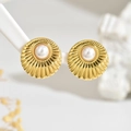 Macro shot of gold starburst earrings with central pearl on white display stand - Gold Pleated Pearl Studs