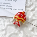 Detailed view of a hand-painted red and gold ceramic goldfish bead for DIY jewelry making - Price per Piece / Red White and Yellow