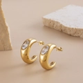 Minimalist gold C-shaped earrings with oval zircon stone on a natural stone base - Transparent Zirconia Style (ER-100)