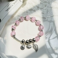 Delicate pink crystal beaded bracelet featuring silver leaf and shell charms on white tray - S056-pink Shell Leaf Safety Buckle Bracelet #sz469