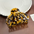 Elegant tortoiseshell acetate hair claw clip with hollow design and glossy finish - Tortoiseshell Brown Pumpkin Claw