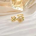 Detailed close-up of a gold flower open ring with green leaves and zircon inlay - White Flower Green Leaf Rhinestone (JZ0112)