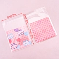 Cute cartoon ziplock bags with pink rabbit patterns showing 7x7cm dimensions in a flat lay - Small / 50 Pieces / Heart Rabbit