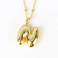 Detail of puffed 3D letter N pendant in gold with textured beaded rope chain - Letter N