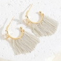 Close-up of zircon earrings featuring chain tassels and gold C-shaped metal hoops - Butterfly Zirconia Tassel Earrings (ES2361-9)