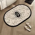 Oval black and white floral bath mat with Lucky logo and butterfly patterns on wood floor - 30*50cm - Upgrade Thickened Diatom Mud / Branch Shadow Luxury - Oval