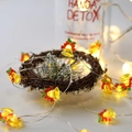Detail of Christmas bell LED string lights with red bows on a rustic brown wreath - 1m 10-LED (2AA Battery Model) / Yellow Bell