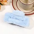 Detail of soft light blue faux fur hair claw clip against a lifestyle background - 11cm Square Plush Claw - Sky Blue