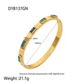 Detailed view of gold plated stainless steel bangle with emerald green zircon stones - Rectangle Green Zirconia Bangle / Gold/Green
