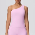 Detail of light pink one-shoulder sports bra showing high elasticity fabric and slim fit - Sakura Pink