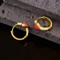 Detailed macro view of gold heart hoop earrings with cream enamel finish and pink center - Yellow Heart Style (EH0188 Yellow)