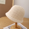 Detailed macro view of beige crochet bucket hat with unique diamond mesh knit texture - Adjustable / Off White