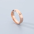 Macro view of rose gold titanium ring with a hand-hammered texture and polished finish - Rose Gold Beveled (6mm)