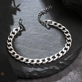 Silver Cuban link bracelet in titanium steel with lobster clasp on dark rock background - 6mm Thin (No Extension Chain) / 21cm