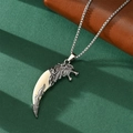 Close-up of a silver wolf head pendant with an off-white fang on a box chain necklace - Wolf Tooth Pendant