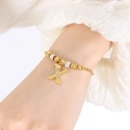 Elegante goudkleurige box chain armband met letter X hanger en witte zirkonia - Gouden Armband - Letter X