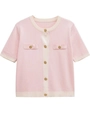 Close-up of pink knit cardigan with contrasting white trim and golden embossed buttons - Light Pink
