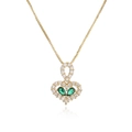 Detail of gold heart pendant with green pear-cut gems and clear crystals on white base - Green Pear Stone Heart
