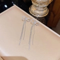 Silver bow dangle earrings with long rhinestone tassels on a champagne leather tray - E0169 Silver Needle (Bow Full Diamond Double Tassel Silver)