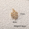 Detail of 17mm gold leaf pendant with crystal zircon inlay and precise dimensions - Gold Mini Monstera Leaf