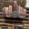 Detailed shot of amethyst crystal hair comb featuring a silver Celtic moon goddess symbol - Strawberry Quartz Black Wire Silver Moon