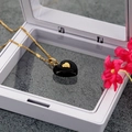 Elegante gouden ketting met zwarte hartvormige hanger en klein gouden hartdetail - Zwart Hart
