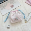 Pink striped drawstring bag with white lace heart detail on a soft cozy background - Pink Stripes