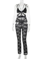 Detail eines schwarzen Spitzen-Bodysuits mit Schleifenbrust und sexy Taillenausschnitt - S / Schwarz