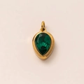 Detailed close-up of a pear-cut emerald gemstone pendant with an 18k gold-plated frame - May Birthstone Pendant (Emerald)