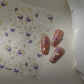 Detail view of butterfly nail stickers with gold foil and white pearl chain designs - Purple Butterfly Pearl Chain Series (CO-467)