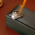 Detailed view of silver open ring with zircons and pearls on a jewelry box - Silver