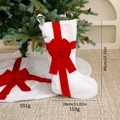 White faux fur Christmas stocking with red velvet bow and matching plush tree skirt - Tree Skirt + Christmas Stocking
