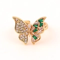 Macro detail of butterfly ring with green and white zircons in gold setting - Green and White Micro Pave Butterfly (Style 7)