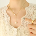 Elegant gold necklace and pearl ring set with wheat ear pendants on female model - Gold Sliding (3 Pearls)