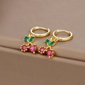Close-up of cherry-shaped huggie earrings with red and green gemstones on a jewelry box - Gold Cherry
