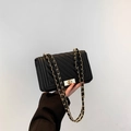 Fashionable black quilted shoulder bag with chevron pattern and gold metal chain strap - Black