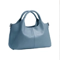 Blue soft PU leather tote bag with lychee texture and woven handles on white background - One Size / Teal