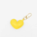 Detail of a yellow heart-shaped leather keychain with a premium golden metal clasp - With Buckle / Yellow