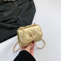 Champagne gold quilted mini chain bag with metallic finish and rectangular turn-lock - Gold