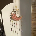 Golden moon suncatcher with pink crushed stones and colorful crystal prisms hanging in sunlight - M9-Watermelon Red