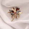 Elegant floral brooch with multicolored crystals and gold-tone finish on silk fabric - Colorful Flower