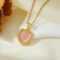 Detail of a gold heart necklace with pink opal stone and zircon edge on a white stone - Gold Pink Stone Heart Necklace (T021)