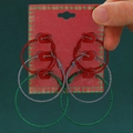 Three pairs of festive glitter coated hoop earrings in red, silver and green colors - Glitter Hoop Set (0155)